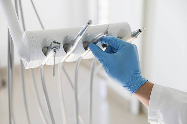 Professional Tooth Extraction technician working in Siloam Springs, AR
